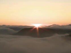 sunrise over landscape covered in fog Stock Footage