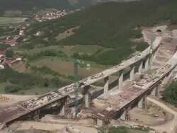 AERIAL over highway construction site on edge of forest/ Slovenia Stock Footage