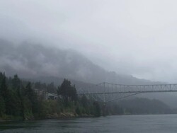 WS PAN View of Bridge of Gods that spans Columbia River from Oregon to Washington / Hood River, Oregon, United States  Stock Footage