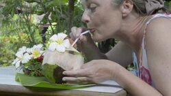 Woman drinking fresh coconut milk Stock Footage
