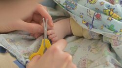 cutting nails of baby Stock Footage