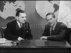 1953: NEW YORK, NEW YORK: ON SET: Governor of New York Thomas E. Dewey (1902-1971) sitting w/ Westbrook Van Voorhis behind desk w/ globe maps BG, SOT Dewey saying they (Chinese Nationalists) have made real progress. Instructional Video