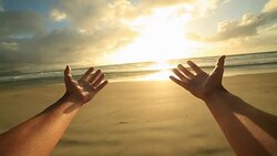 Woman's arms stretch towards a beautiful sunset Stock Footage