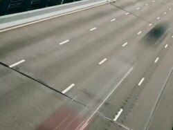 Time lapse, graphic dutch angle, traffic races under camera on the Ben Franklin Bridge. Stock Footage