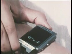 A hand demonstrates the Japanese manufactured wristwatch televisions to be sold in America. News Clip