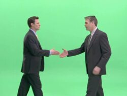 MS, Two businessmen shaking hands in studio Stock Footage