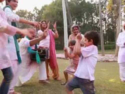Indian joint family playing holi and dancing, Delhi, India Stock Footage
