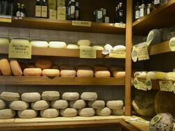 MS Shot of Pecorino cheese in delicacy shop / Pienza, Tuscany, Italy Stock Footage