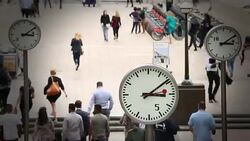 Communters with clocks Stock Footage
