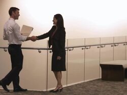  WS Business associates meeting in lobby with other associates walking past / Seattle, Washington, United States Stock Footage