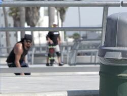MS SLO MO Shot of guy skating and jumping over rail / Venice, California, United States Stock Footage