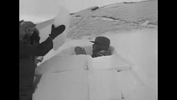 Members of military expedition 'Operation Muskox' building igloo in Churchill, Manitoba, in Canada News Clip