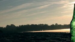 Green bottle on beach, Lake, Garbage Stock Footage