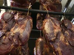 MS Shot of ham at smokehouse in butchery / Freudenburg, Rhineland Palatinate, Germany Stock Footage