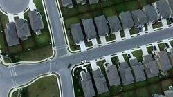 Aerial Straight Down View Neighborhood Housing Community Round Rock near Austin , Texas Suburbia Streets houses roads yards house to house Stock Footage