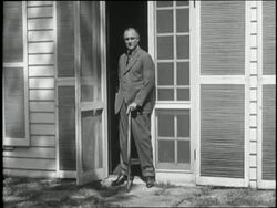 New York Governor Franklin D. Roosevelt stands with a cane in a doorway in 1930. News Clip