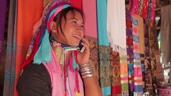 woman wearing the traditional with mobile phone at a weaving in village Stock Footage