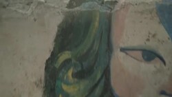 W/S CRANE UP suspension bridge over Ganges river, Rishikesh, India Stock Footage