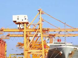 Cargo ship unloading goods at shipping port Stock Footage