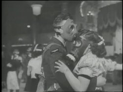 British soldiers and women wear gas masks and ballroom dance in 1941. News Clip