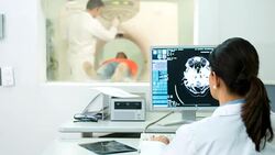 Doctor reading a CAT scan Stock Footage