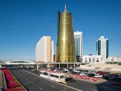 Central Asia, Kazakhstan, Astana, Presidential Palace and the twin golden conical business centres - Time lapse Stock Footage