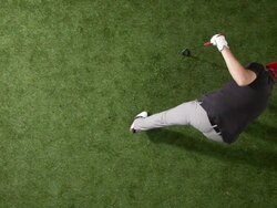 MS, Lockdown, golfer swinging club and hitting golf ball, overhead view Stock Footage
