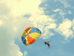 HD: Paraglider Soaring Over The Beach Stock Footage