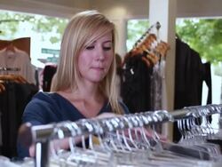 MS Women looking at rack then on camera  / Portland, Or, United States Stock Footage
