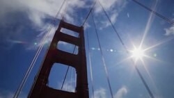 Small patches of fog roll across a tower of the Golden Gate Bridge. Stock Footage