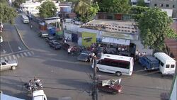 Traffic flows through a suburban intersection. Stock Footage