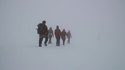 Hiking in winter blizzard Stock Footage