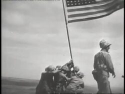 A group of US Marines raise an American flag at Iwo Jima. News Clip