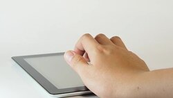 Using a Tablet PC on white background Stock Footage