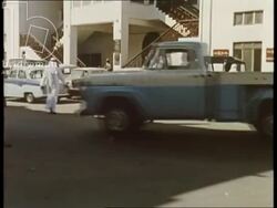 Bahrain 1960s - Manama city, high street and bazaar, loading bay with cranes Stock Footage