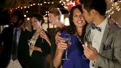Happy couple with multi-ethnic friends celebrating with champagne Stock Footage