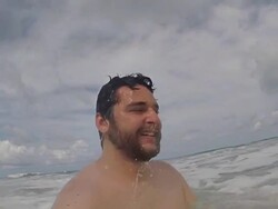 Man at beach waves Stock Footage