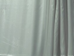 Curtain hiding hospital bed and a dropper bag with medication Stock Footage