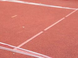 BASE jumper prepares parachute for jump, parking area Stock Footage