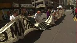 Anti Donald Trump protesters giant banner News Clip