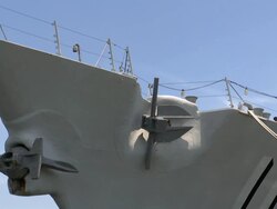 Medium Close Up pan-right tilt-up-A ship docks in a bay. / Mississippi, USA Stock Footage