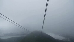 Cable car riding on the sky and heading to the station. Stock Footage