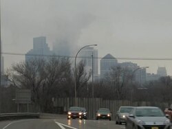 Morning traffic heading towards Minneapolis during rush hour with the city skyline in the background Stock Footage
