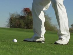 Golfer hitting wedge shot in slow motion Stock Footage