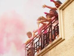 Group of kids playing holi festival on roof top  Stock Footage