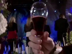 PO Three partiers lift glasses in foreground, with dancers on stage behind Stock Footage