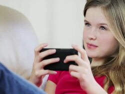 Pretty young teenage girl sending text message Stock Footage