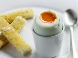  CU PAN Shot of Toast dipped into blue egg / London, United Kingdom  Stock Footage