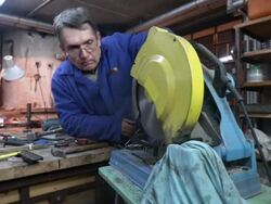 HD DOLLY: Toolmaker Working With Circular Saw Stock Footage