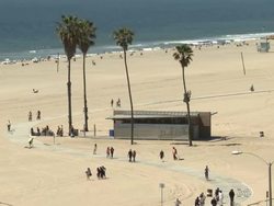 People enjoying sun on Santa Monica beach News Clip